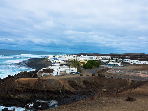 Panorama view of volcanic beach and rocky coastline from El Golfo. Seen from Charco de los Clicos viewpoint. Lanzarote, Canary Islands, Spain