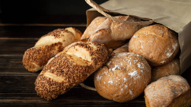 istock Freshly baked bread in a brown paper bag 1854426299