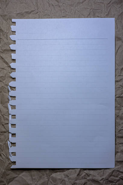 Note paper on a crumpled brown background. Notebook page with copy space.