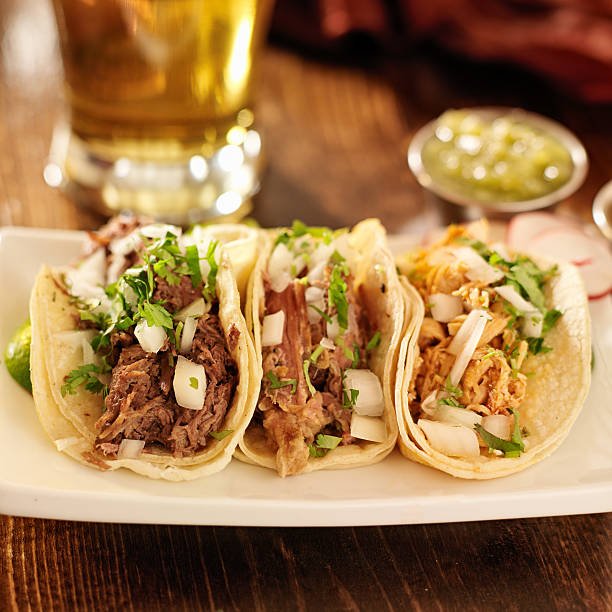 istock authentic mexican barbacoa, carnitas and chicken tacos 185443262