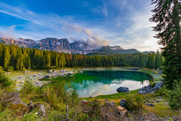 istock Lago di Carezza, an alpine marvel with emerald waters, cradled by spruce trees, framed by the majestic Dolomites, a fairy tale woven into nature's enchanting panorama 1854436408