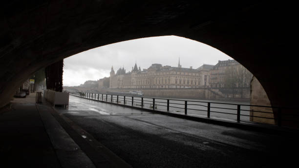 Torrential rain and the Supreme Court viewed from under Pont-Neuf