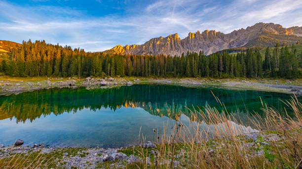 istock Lago di Carezza, emerald waters, enchanting Spruce forests, Latemar mountain vistas. A South Tyrol and Dolomites gem, captivating in every frame 1854441159