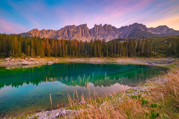 istock Lago di Carezza,Emerald waters, misty forests, Latemar views, an enchanting Alpine canvas. A beloved South Tyrol gem, guide for essential tips 1854454594