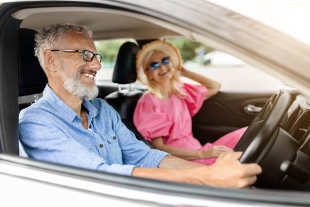 istock Cheerful retired man and woman travelling by auto 1854455656