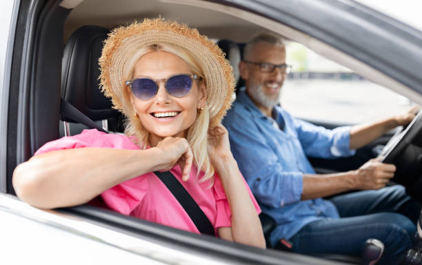 istock Positive beautiful senior lady smiling from car window 1854456230