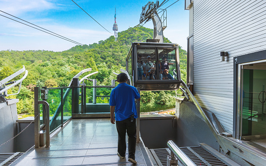Seoul, South Korea, June 17, 2023: The cable car ride to N-Seoul Tower offers a stunning city view, making it a popular tourist spot in Seoul.