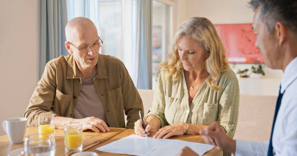 istock Mature woman signing document 1854478321