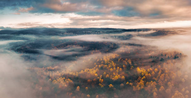 istock Atmospheric fog over autumn landscape 1854478735