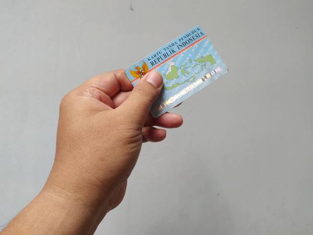 istock show the population identity card, by hand 1854478801
