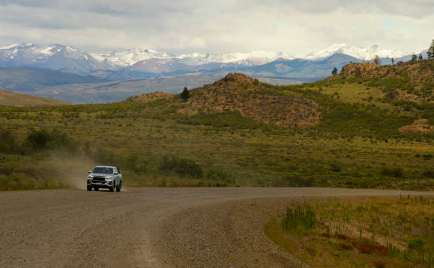 istock truck approaching on a dirt and mountain road 1854510221