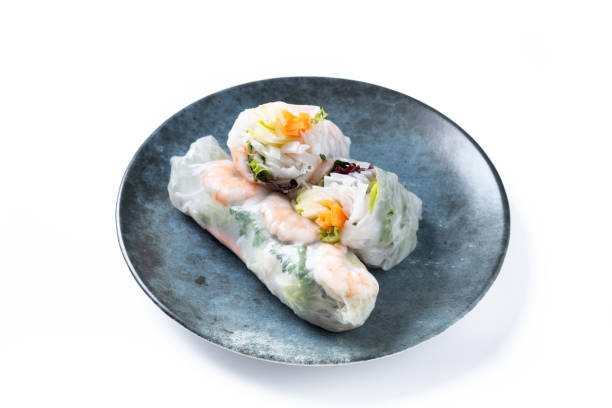 istock Vietnamese rolls with vegetables, rice noodles and prawns isolated on white background 1854518346