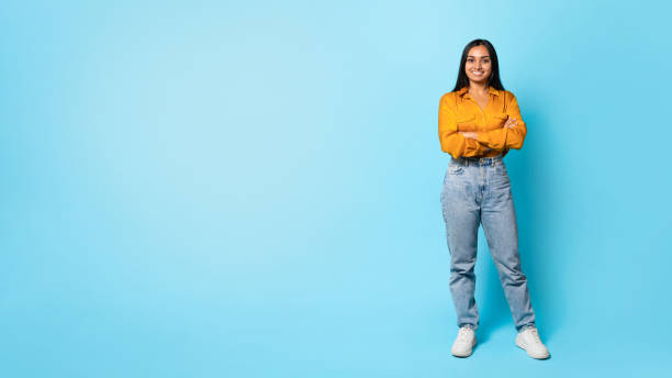 istock Cheerful Middle Eastern Woman Standing Over Blue Background, Full Length 1854526895