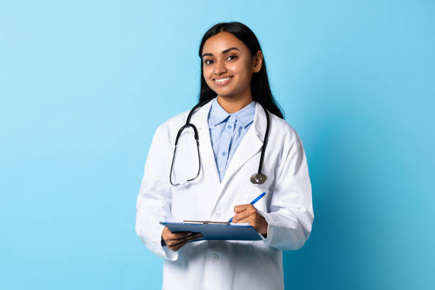 istock Professional Indian lady physician with stethoscope and medical chart, studio 1854528543