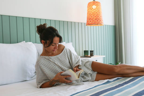 istock Woman of Middle Eastern ethnicity reading a book. 1854573291