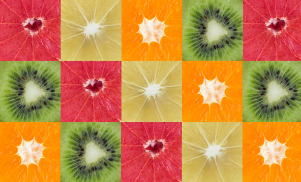 istock Squares of citrus fruit and kiwi. Pattern. Flat lay. Close-up. 1854577174