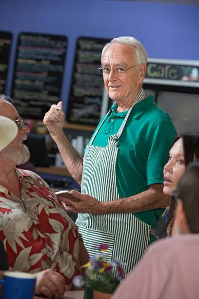 Photo of Handsome Host with Patrons