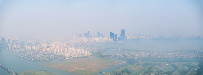Aerial Photography of Suzhou Jinji Lake Scenic Area and Urban Architecture amidst Clouds and Mists