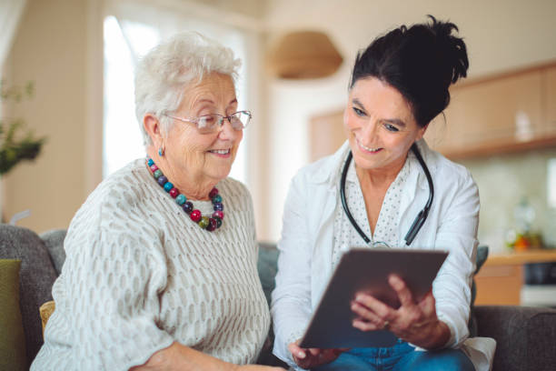 istock Social worker is visiting a senior woman 1854581517