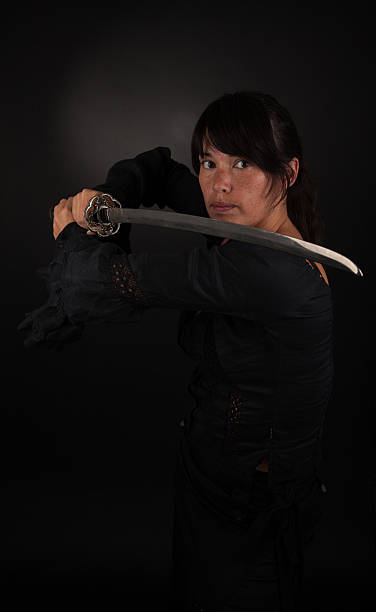 istock Asian woman holding her sword 185459198
