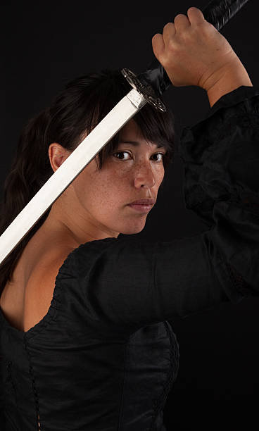 istock Asian woman grabbing her sword 185459232