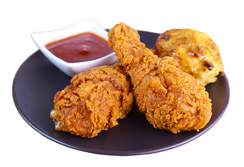 Golden Brown Crispy Fried Chicken Drumsticks with Biscuit and Dip on White Backdrop