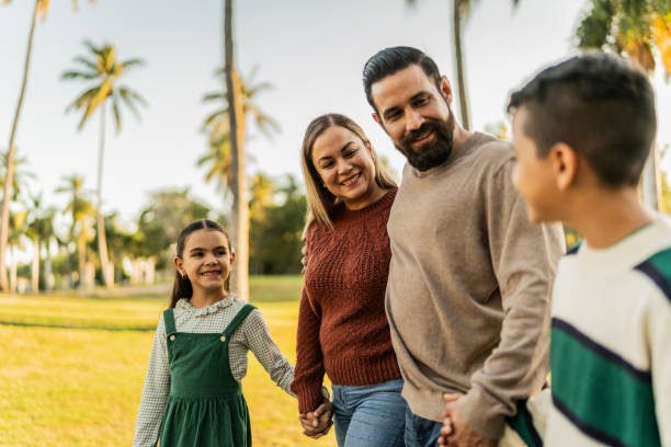 Family talking while walking through the public park