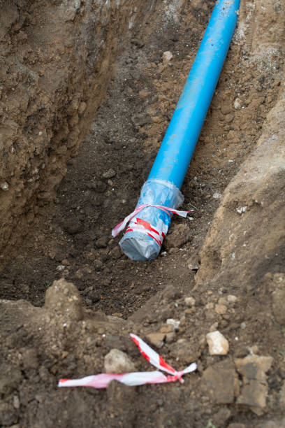 istock Plumbing pipe laying. Plastic polypropylene pipe. Sanitary, sewer drainage system for a multi-story building. Civil infrastructure pipe, water lines and storm sewers. Selective focus, shallow depth 1854623648