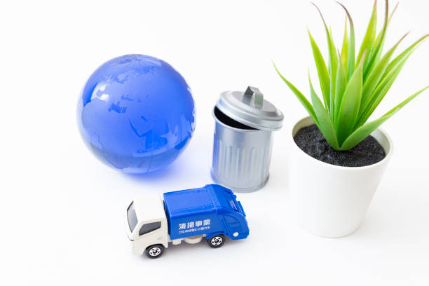 istock Garbage truck, trash can and earth. 1854654832
