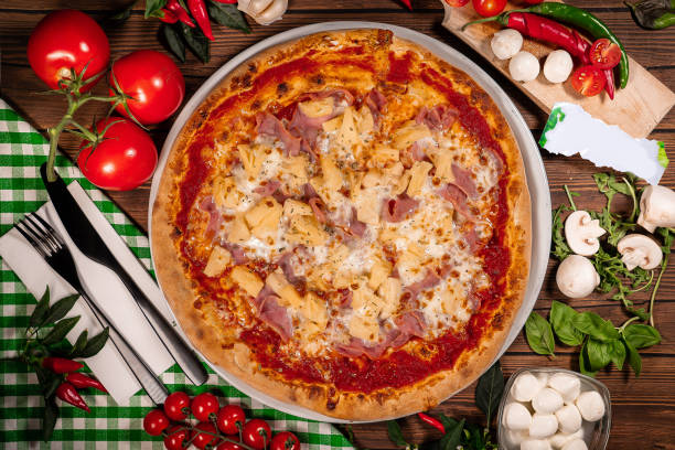 istock Italian hawaii Pizza ham and pineapple ananas 1854657519