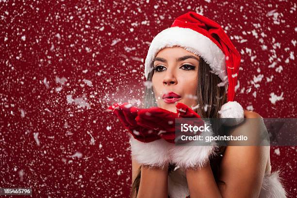 Beautiful Santa Claus Woman Blowing Snowflakes Stock Photo - Download Image Now - Christmas, Sensuality, Mrs Claus