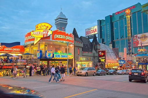 Image is intended for editorial use -  Bright Neon Lights on Clifton Hill in Niagara Falls at Night