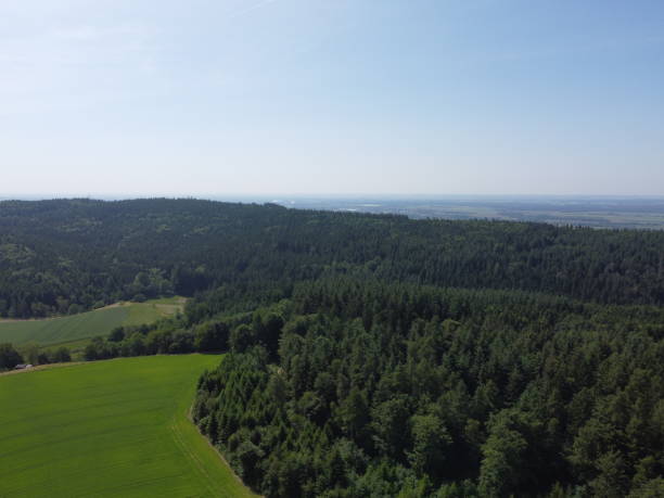 istock Bavarian forest with fields and meadows, aerial 1854684091