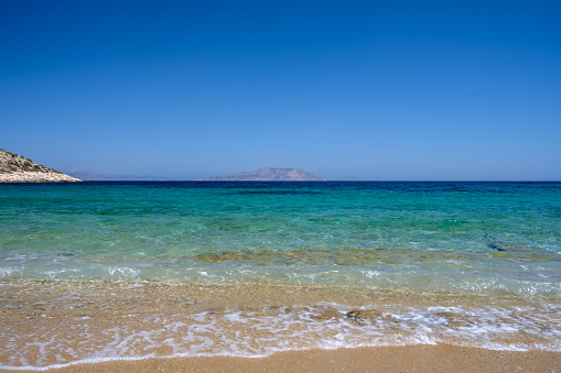 Panoramic view of the amazing sandy and turquoise beach of Agia Theodoti in Ios Cyclades Greece