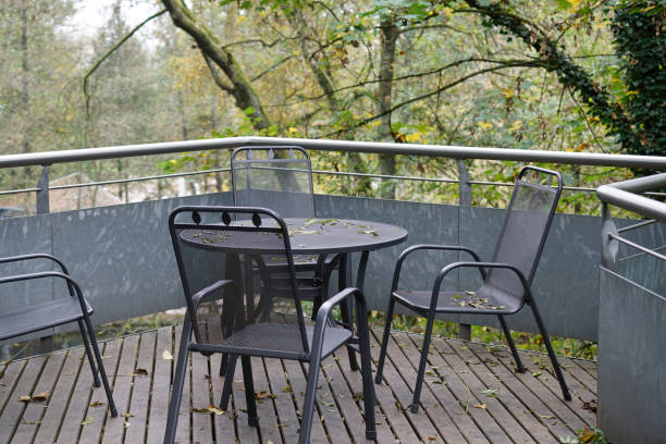 istock Benches and chairs at tables invite you to relax 1854688405