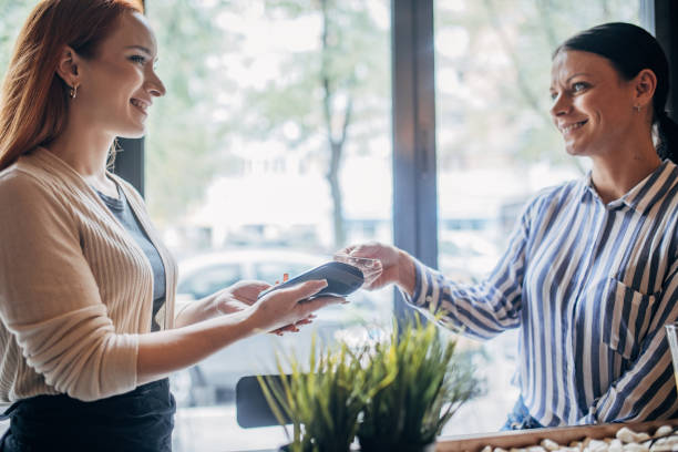 istock Woman making card payment 1854692236