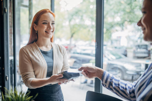 istock Woman making card payment 1854699728
