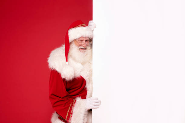 istock Happy Santa Claus with white empty board. 1854742309