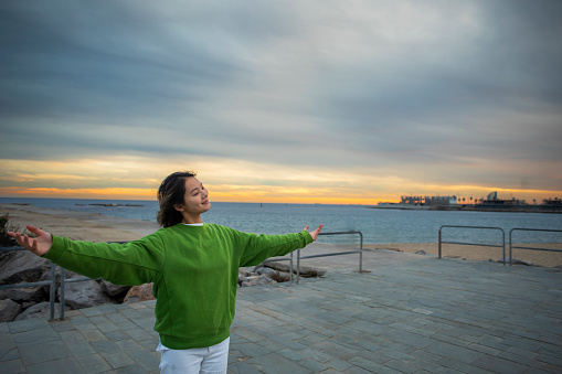 Young Chinese woman at the port of Barcelona