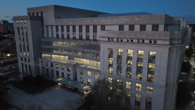 United States government building at night. Aerial view of large federal building in American city during dusk.