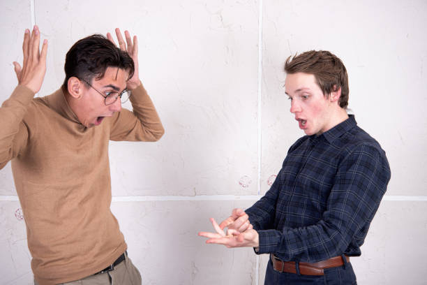istock A beautiful couple is sorting things out. Two guys rejoice and quarrel. 1854759861