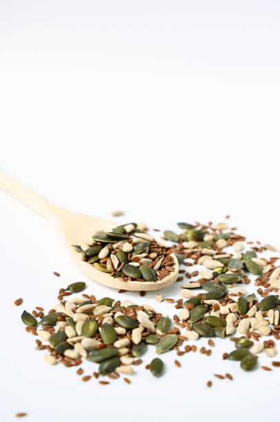 Wooden spoon with dry seeds.