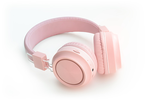 Wireless modern pink Bluetooth headphones on white background