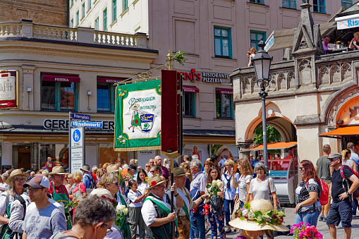 Garden parade with crowd of people at City of München on a sunny summer day. Photo taken August 6th, 2019, Munich, Germany.