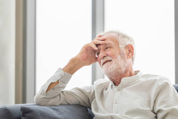 istock Thinking senior man sits on a couch in the living room, Elderly man thinks and sit on the sofa 1854840159