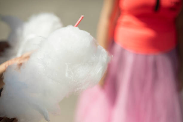 istock Cotton candy on a stick. Sugar food. White cotton wool. 1854841215