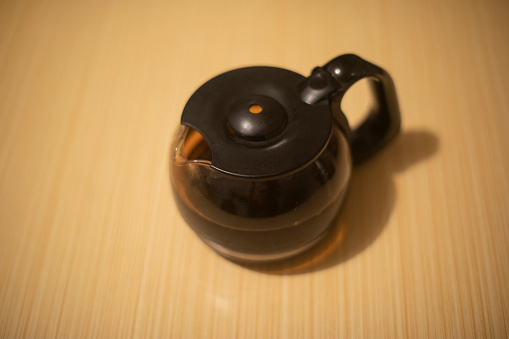 Coffee pot on the table. Coffee in the kettle. Grumbling teapot. Kitchen item.
