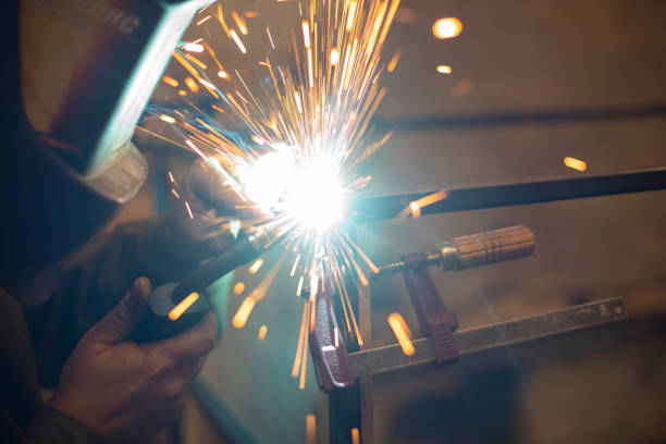 istock Metal welding. Steel welding. Work in workshop. Sparks from heating. 1854848249