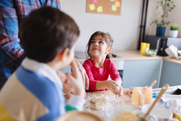 istock Little girl preparing pastry at home 1854848333