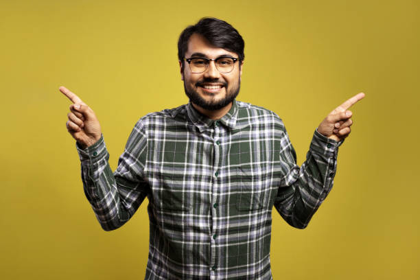 istock man smiling and pointing to both sides with his hands 1854862510
